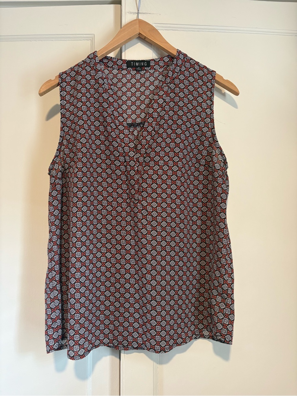 Timing Coral and Black Geometric Patterned Sleeveless Blouse